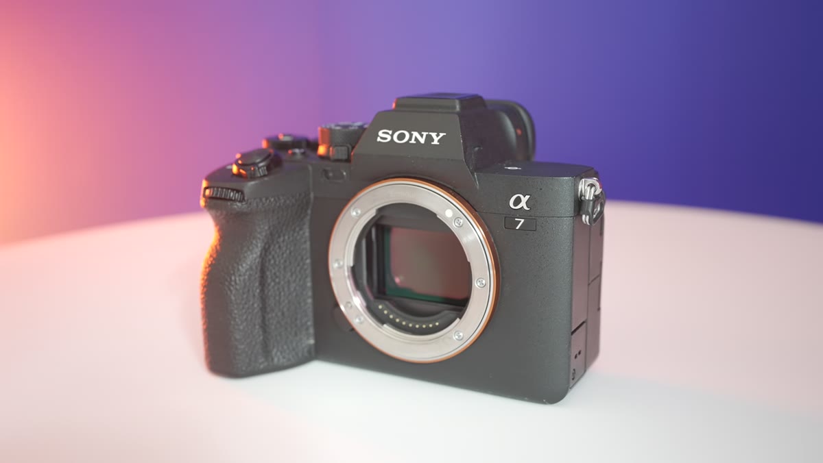 Three cameras side by side on a flat surface