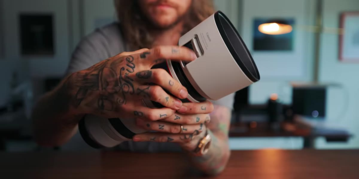 Close-up of lens barrel showing stabilizer and focus switches