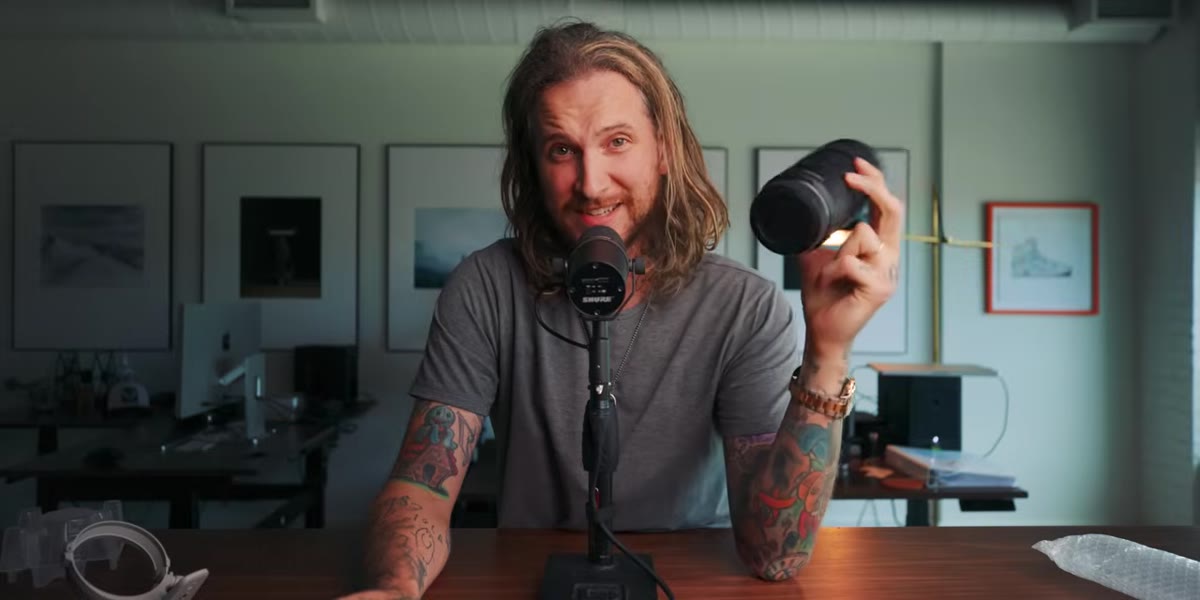 McKinnon gestures toward price difference between the two lenses
