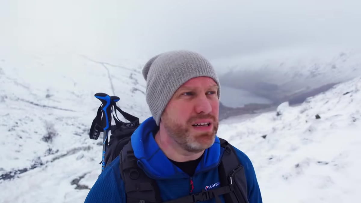 Adam explaining layering principle while hiking outdoors