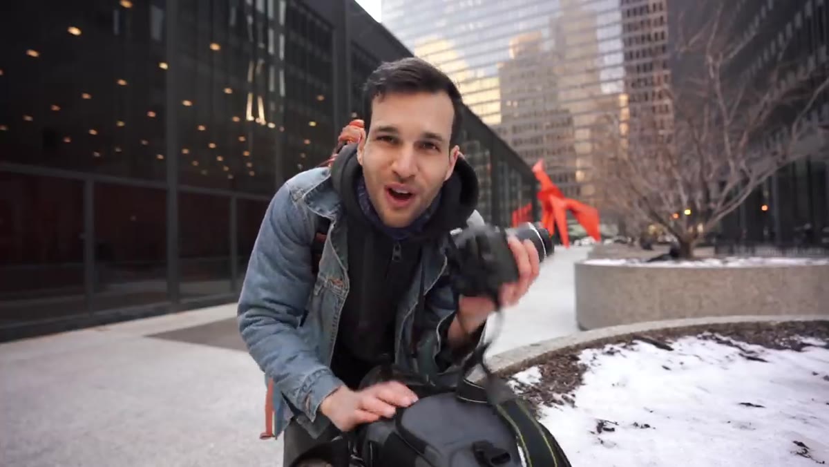 Entry-level DSLR body next to 18-55mm kit lens and 50mm prime