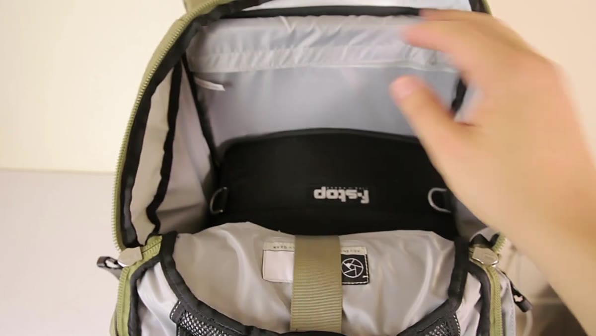 Adam showing laptop/hydration pocket with bladder access port