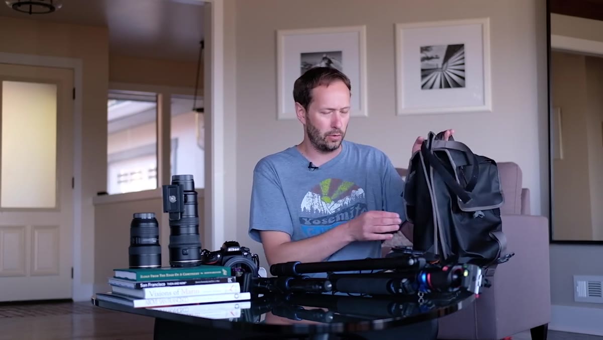 Timbuk2 backpack open on a surface with gear visible