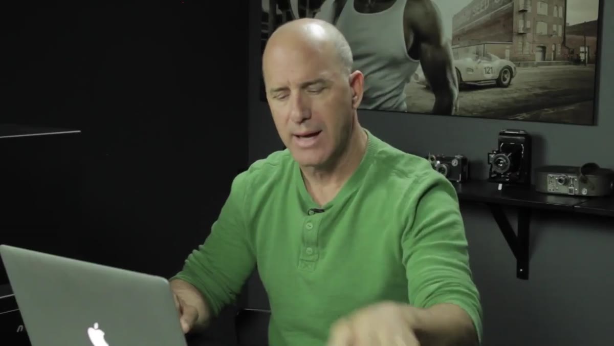 Joel holding up an external hard drive