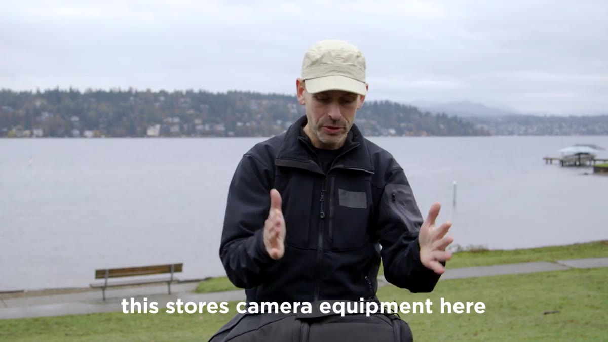 Photographer opening the camera bag compartment