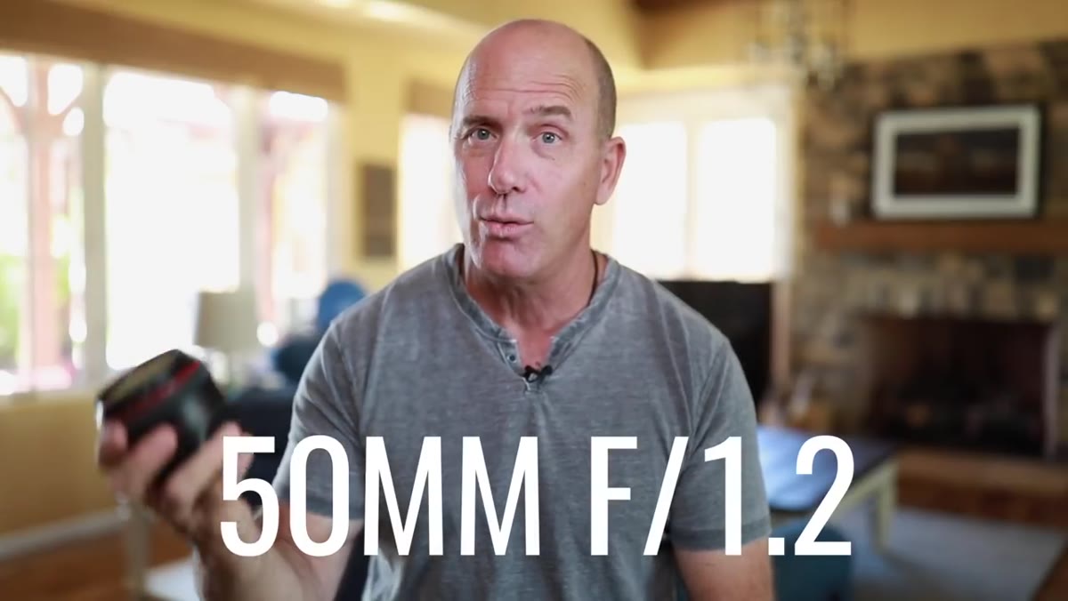 Joel holding the Canon 50mm f/1.8 lens