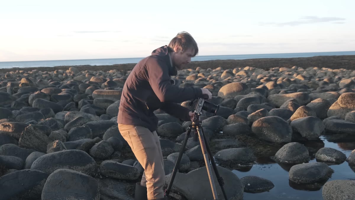 Tripod legs visible in the corner of a wide-angle test frame