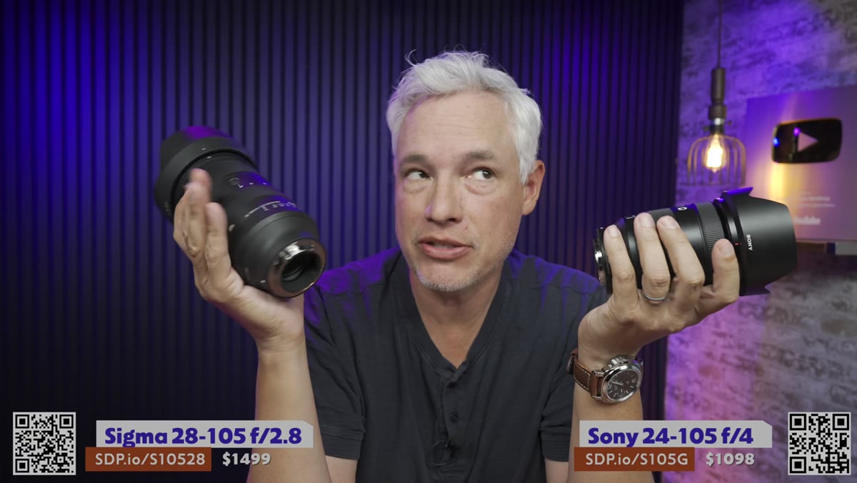 Tony holding both lenses side by side outdoors