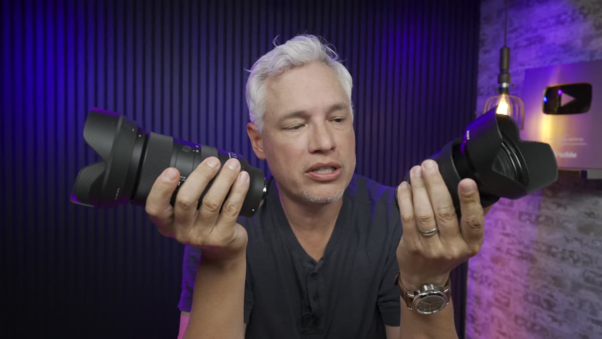 Tony comparing physical size of both lenses in hand