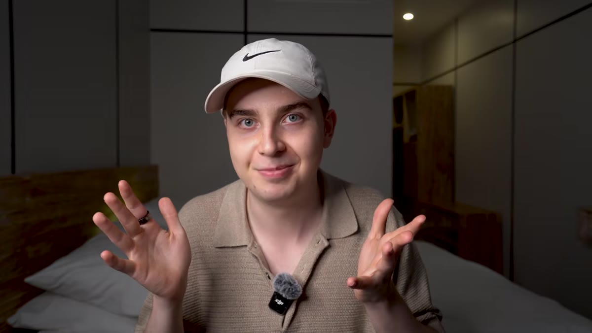 Hugo explaining camera body purchasing mistake at desk