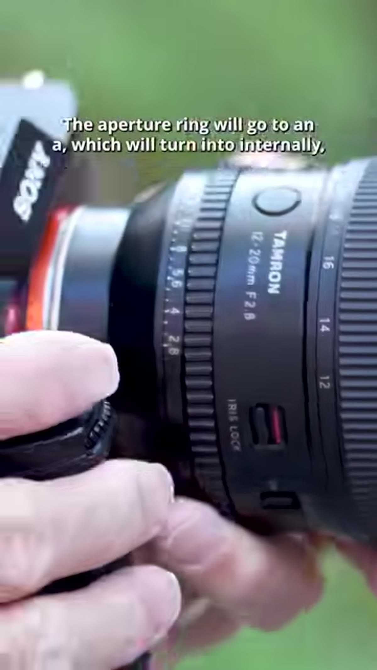 Aperture ring with teeth visible on lens barrel