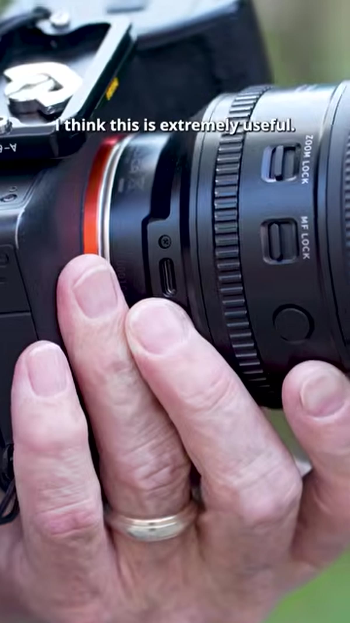 Manual focus lock switch highlighted on lens barrel
