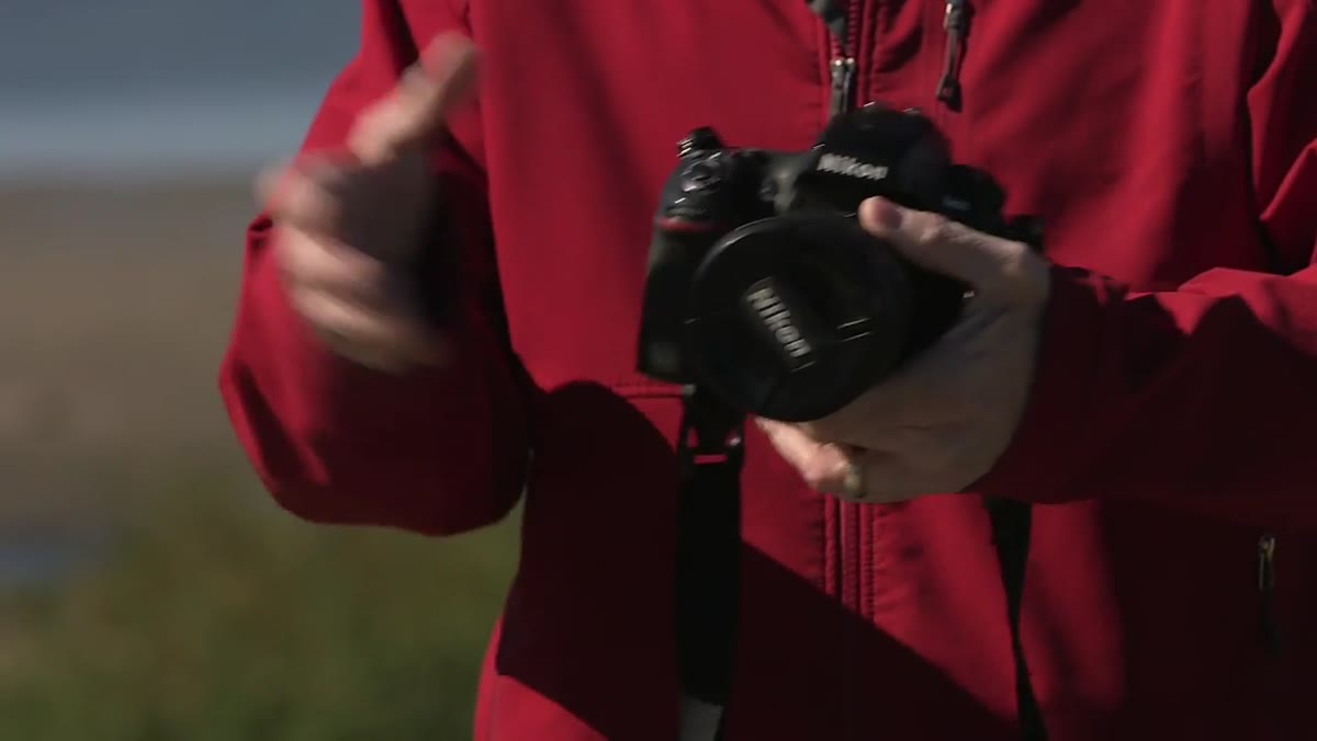 Wide angle lens attached to camera body for time lapse