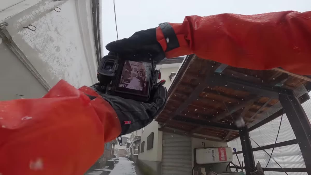 Lambert zooming in digitally to reframe a distant scene