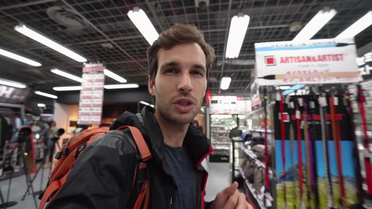 Pierre scanning Sigma lens shelf, discussing Sony versions