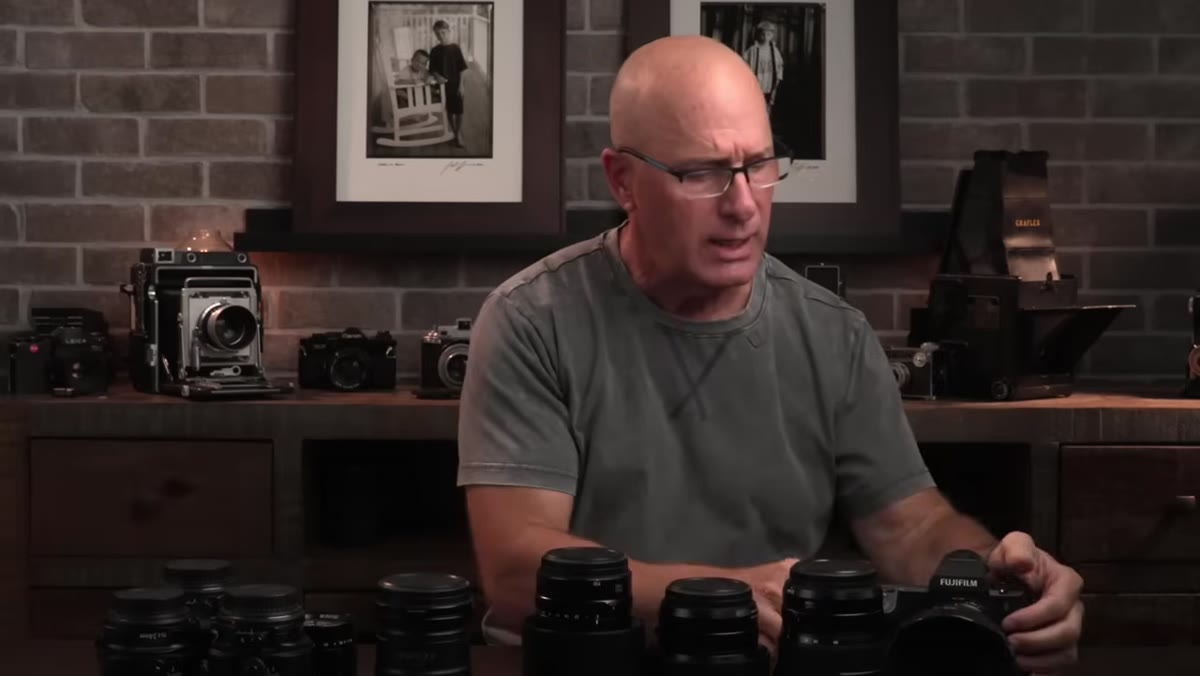 Joel displaying the four GFX lenses he purchased