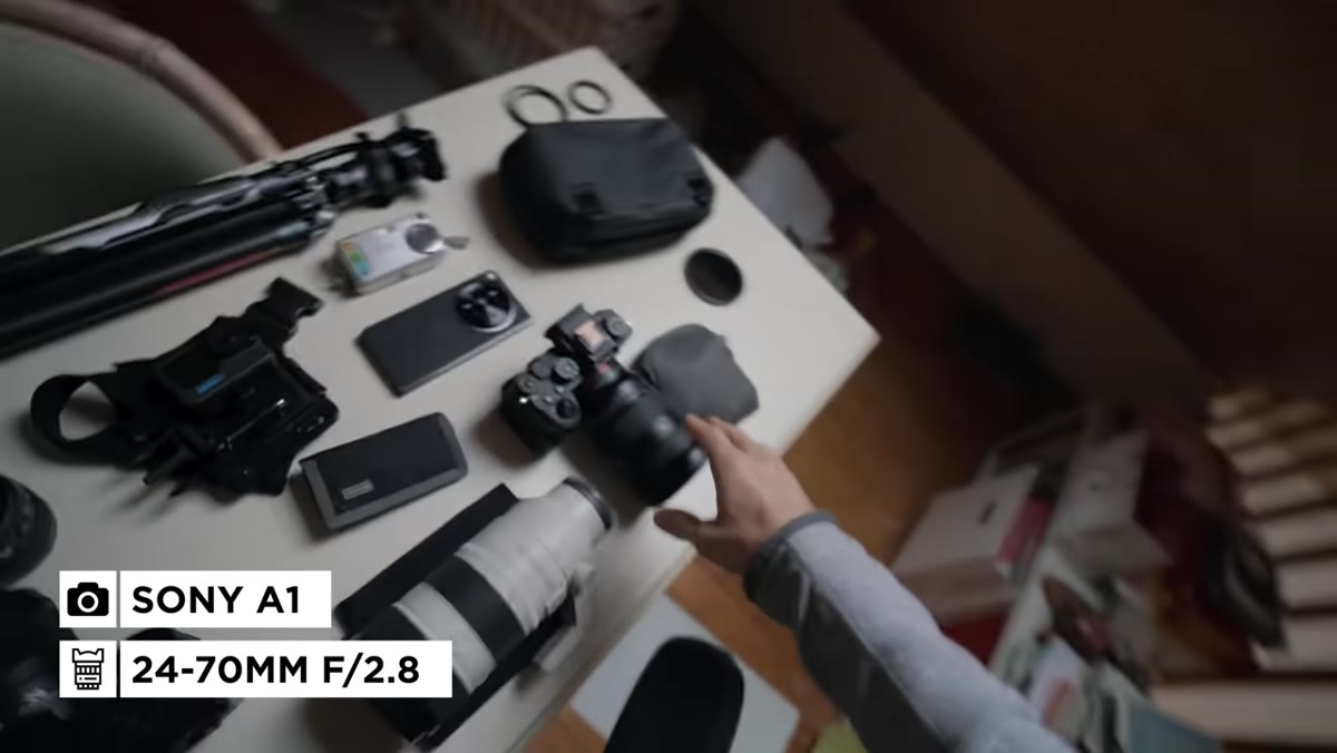 Sony A1 with 24-70mm lens laid out on surface