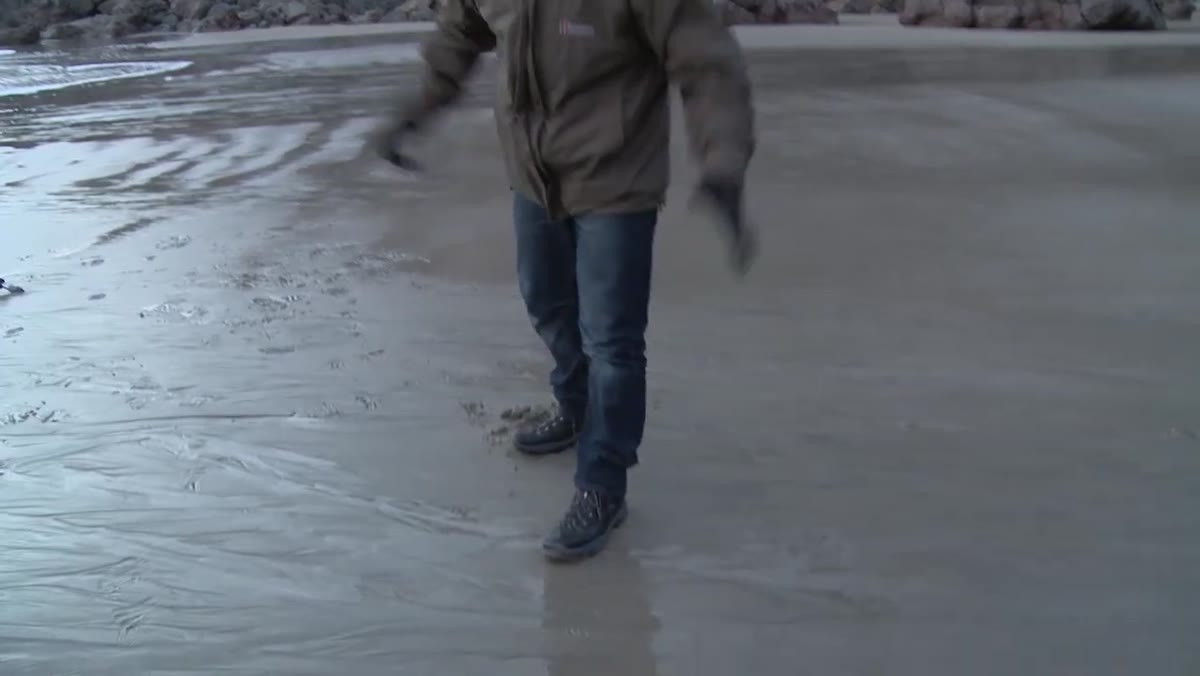 Berghaus hiking boots shown on rocky coastal terrain